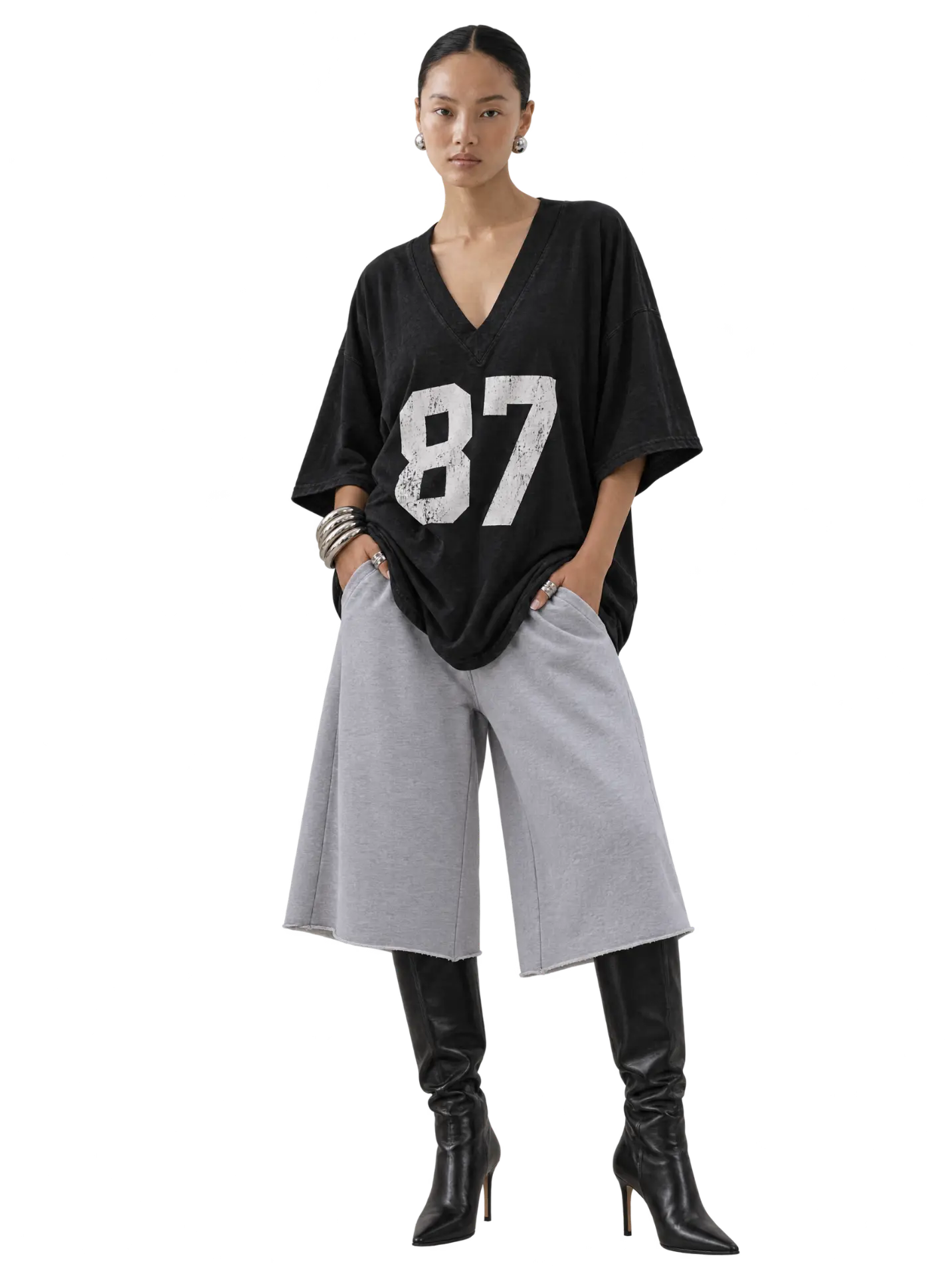 '87 Tunic in Washed Black with grey shorts and boots